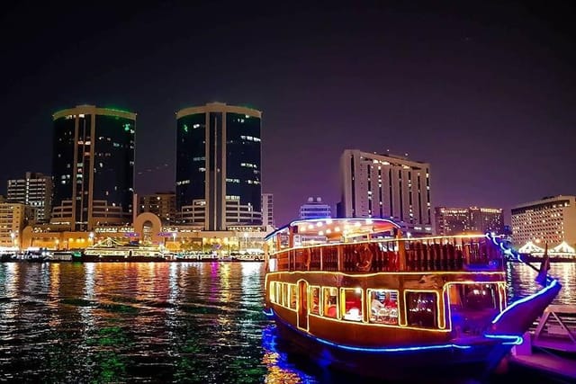 Dubai Creek Dhow cruise boat with Rolex tower